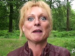 Mature blonde woman, Mendy is having casual sex in the natur...
